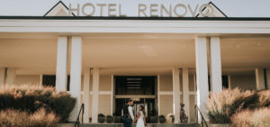 newly wed couple walking in to Hotel Renovo